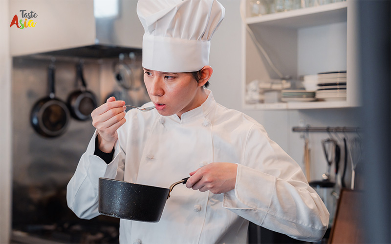 A Chef Examining Dishes